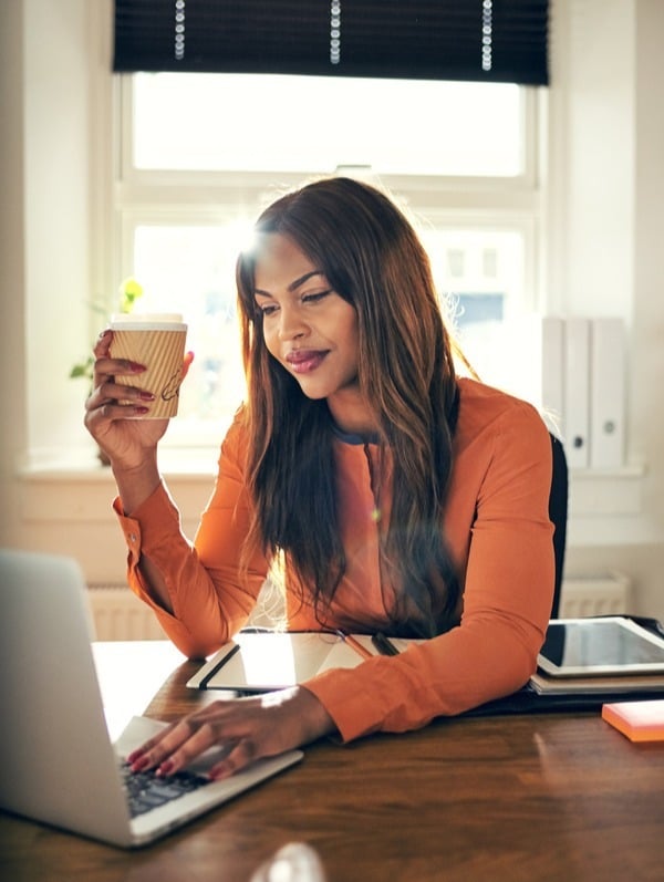 Woman Smiling As She Checks Her Direct Deposit Account-1-1-1